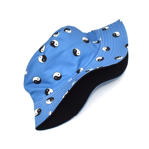 Blue bucket hat with black and white Tai Chi Yin Yang patterns and stitched brim