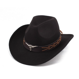 Close-up of black felt cowboy hat featuring a brown leather band and silver bull head detail