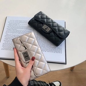 Quilted diamond pattern long wallet for women with metallic twist lock and sleek finish