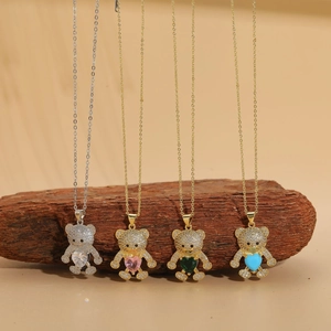 Detail of bear pendants with colorful heart-shaped stones and pavé cubic zirconia