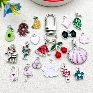 DIY colorful enamel fruit and animal charms set with silver keychain on white background