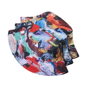Close-up of colorful tie-dye bucket hats with abstract oil painting style print pattern
