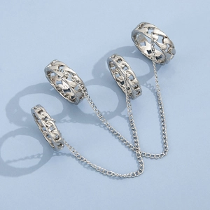 Detailed view of silver punk chain ring set featuring four interconnected metal bands