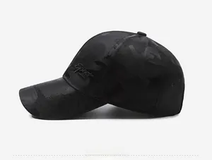 Detail of black camo baseball cap featuring side Sport embroidery and mesh panels
