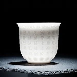 Chinese white suet jade porcelain tea cup with embossed longevity and blessing motifs