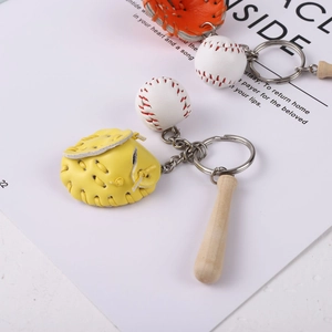 Detailed view of mini baseball glove, bat, and ball keychain set with metal links