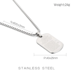 Macro shot of stainless steel pendant with lotus engraving and Buddhist heart sutra