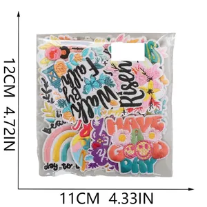 Set of 16 embroidered patches with floral and rainbow designs in a transparent poly bag