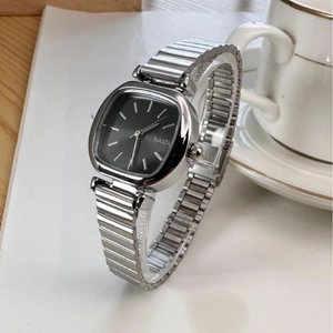 Elegant square silver stainless steel watch for women with black dial on a desk