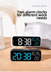 Detailed view of 9 inch LED digital alarm clock showing time, date and room temperature