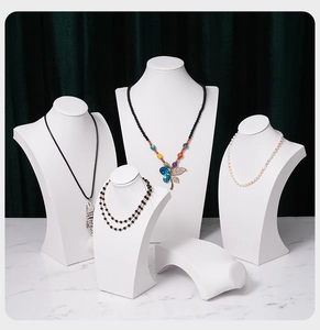 Set of 5 white acrylic necklace display stands featuring layered beads and pendants