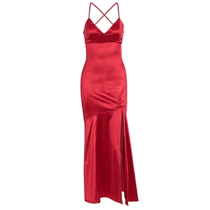 Detail of red satin backless dress featuring thin criss-cross straps and silky texture