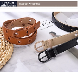 Detailed view of candy color grommet belts with D-shaped buckles on marble background