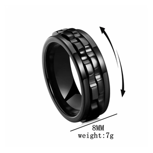 Detail view of 8mm black spinner ring for anxiety relief with gear texture