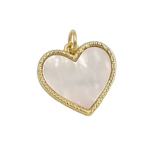 Golden heart pendant with white mother of pearl inlay and textured bead edge finish
