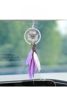 Car dreamcatcher pendant with purple feathers and metal deer head on rearview mirror