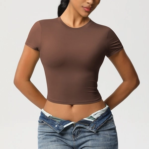 Close-up of slim fit brown short sleeve yoga top with high-stretch quick-dry fabric