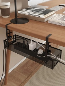 Detail of black metal mesh under desk cable tray with adjustable screw clamp mount