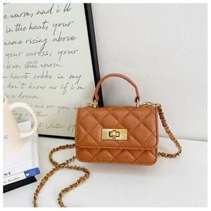 Detailed view of brown quilted PU leather mini square bag with gold chain and square lock