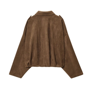 Detail view of brown faux suede texture and lapel collar on a cropped bomber jacket