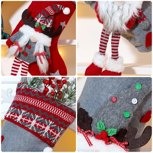 Close-up of knit Christmas stocking details featuring a cute gnome and plush texture