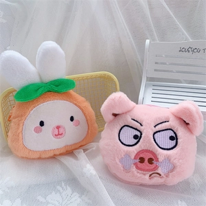 Cute plush rabbit and pig coin purses for storage on a white decorative background