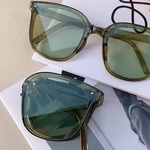 Detailed comparison of olive green sunglasses in unfolded and compact folded states