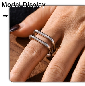 Macro view of minimalist silver double-layer U-shaped ring on a model's finger