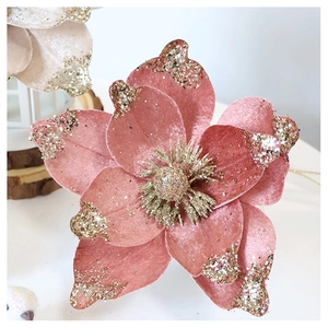 Macro view of velvet champagne flower with gold glitter edges for Christmas decor