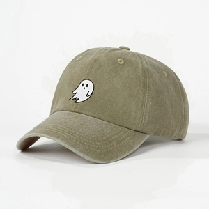 Detail of ghost embroidery on washed cotton olive green baseball cap with sharp stitching