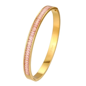 Gold stainless steel bangle featuring full pink baguette-cut cubic zirconia crystals