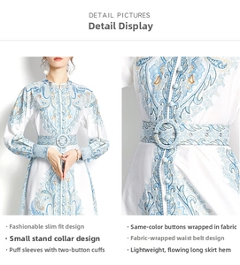 Detail of paisley print maxi dress with fabric-covered buttons and matching belted waist
