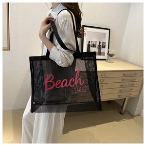 Mesh beach tote bag with pink Beach Vibes text showing capacity and breathability