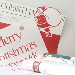 Red and green Christmas wrapping paper with Santa Claus pattern and Merry Christmas text