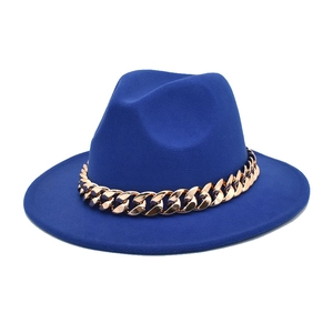Close-up of bright royal blue wool fedora hat with decorative thick gold chain link