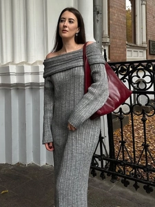 Detail of off-the-shoulder grey knitted dress with vertical ribbed texture and long sleeves