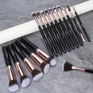Detail of 18 professional makeup brushes with soft synthetic bristles and rose gold ferrules