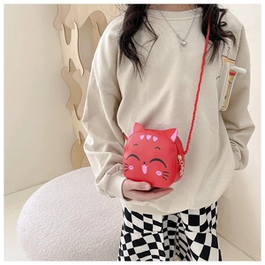 Cute red kitten-shaped crossbody bag for children with woven strap and cartoon cat design