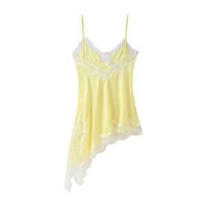Detail showing yellow satin lingerie dress with delicate lace trim and asymmetrical hem