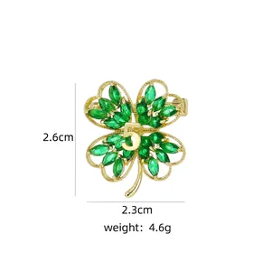 Detail showing dimensions of green four-leaf clover brooch with golden number 5