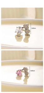 Detail of silver bow and heart cubic zirconia cartilage studs in white and pink