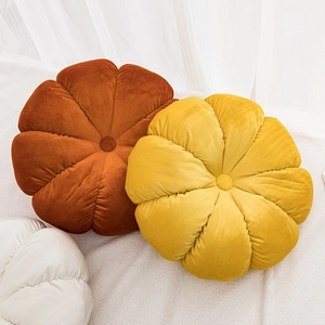 Modern velvet pumpkin cushions in caramel, yellow, and cream white for home decor