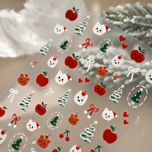 3D embossed Christmas nail stickers featuring festive apples, cats, and trees on white lace