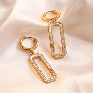 Elegant gold titanium steel hoop earrings with rectangular white shell and zircon charms