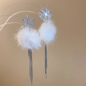 Elegant silver snowflake earrings with white plush pompom and long tassel fringe