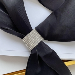 Chic black silk triangle scarf with a square rhinestone buckle for a luxury look