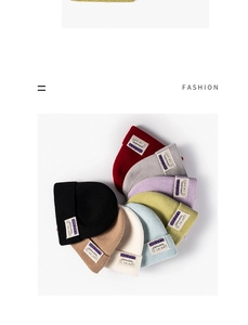 Detailed fan-shaped layout of multi-colored knit beanies with vintage fabric patches