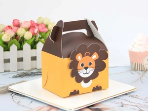 Detail of lion-shaped candy box on a white plate with floral background decor