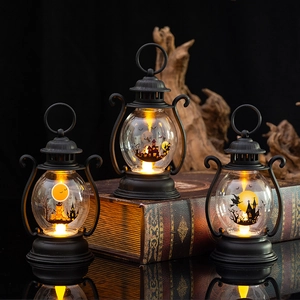 Three Halloween LED lanterns with glowing pumpkin and haunted house silhouette scenes