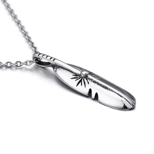 Minimalist silver stainless steel feather pendant necklace for men and women on white background